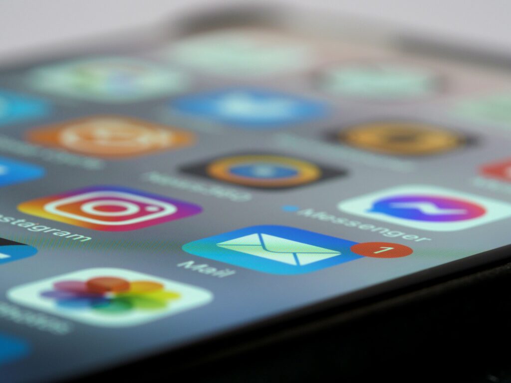 pexels-photo-8829445-8829445 Detailed close-up of smartphone screen displaying various app icons and notifications.